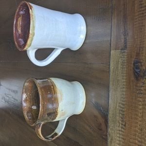 Two handmade ceramic mugs stamped with JRJ